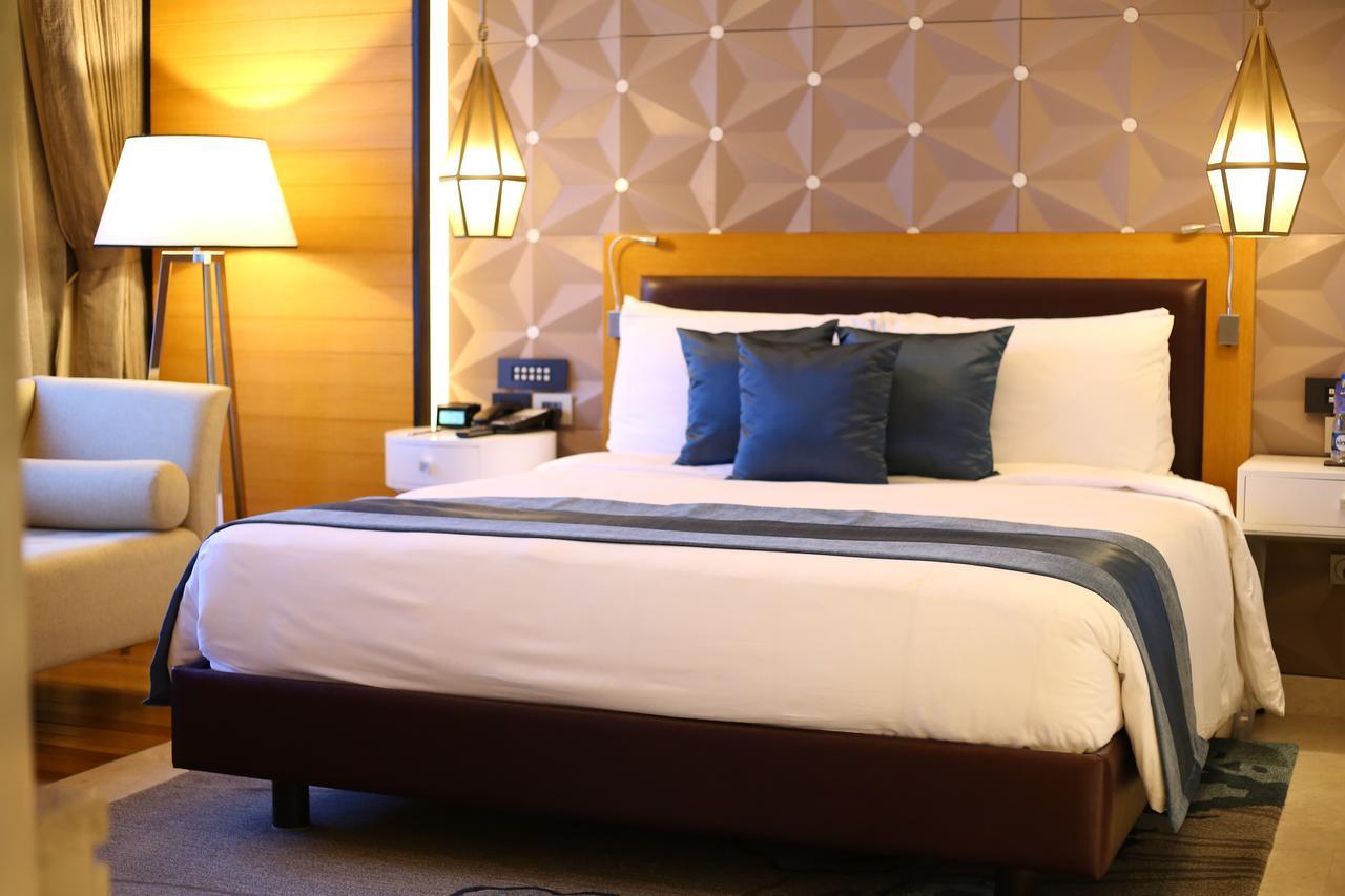 Radisson Blu Coimbatore Exterior photo A bed in a hotel room