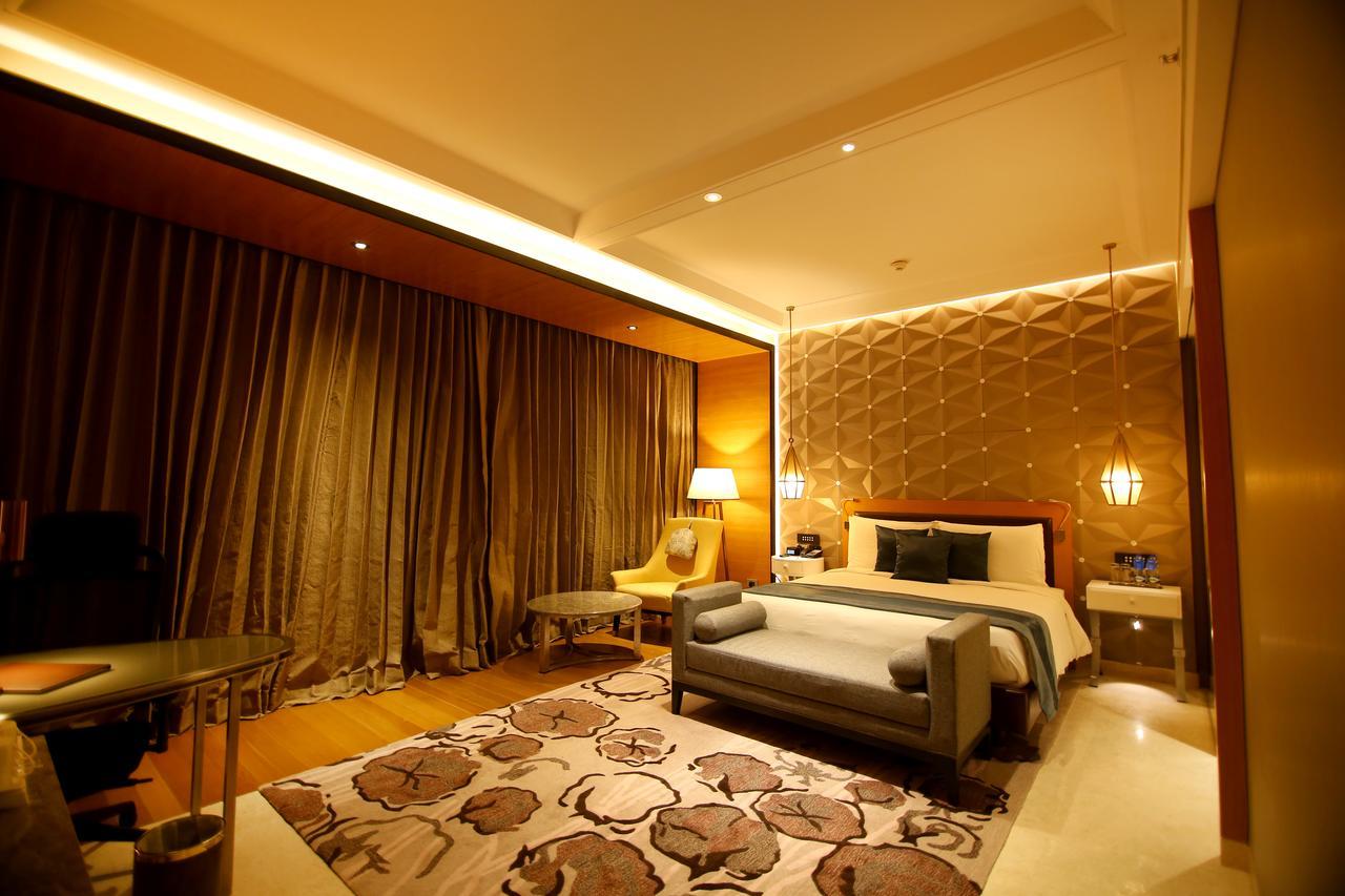 Radisson Blu Coimbatore Exterior photo A bedroom at the hotel